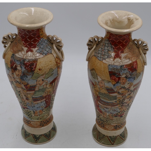 78 - A pair of Satsuma round bulbous thin necked trumpet shaped vases on multi-coloured grounds with figu... 