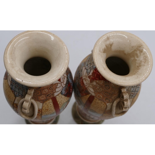 78 - A pair of Satsuma round bulbous thin necked trumpet shaped vases on multi-coloured grounds with figu... 