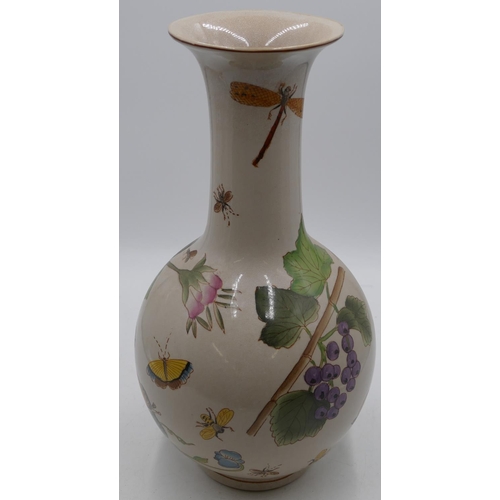 79 - A modern Oriental round bulbous shaped thin necked trumpet shaped vase with multi-coloured inset but... 