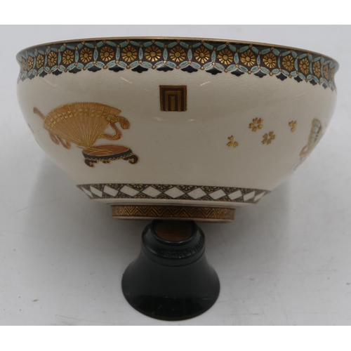 81 - A signed Meiji Satsuma bowl on cream ground with multi-coloured river, landscape, bird, fan and gilt... 