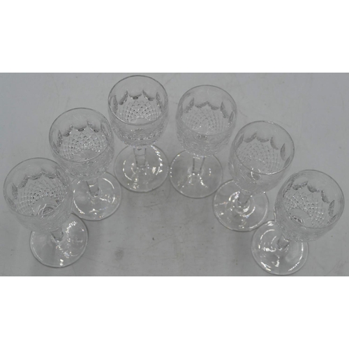 86 - A set of 6 Waterford wine glasses with thumb pattern and tooth cut decoration, hexagonal stems on ro... 