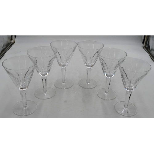 87 - A set of 6 Waterford round trumpet shaped wine glasses with thumb pattern decoration on hexagonal st... 