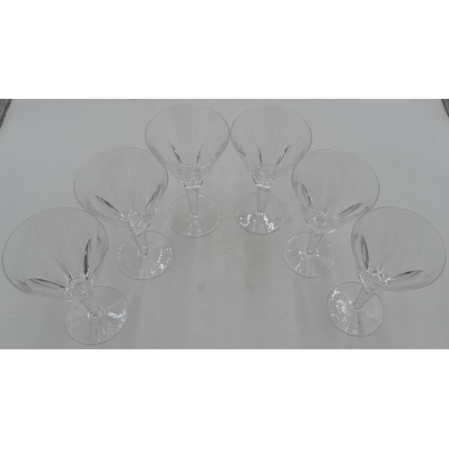 87 - A set of 6 Waterford round trumpet shaped wine glasses with thumb pattern decoration on hexagonal st... 