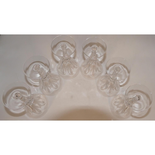 87 - A set of 6 Waterford round trumpet shaped wine glasses with thumb pattern decoration on hexagonal st... 