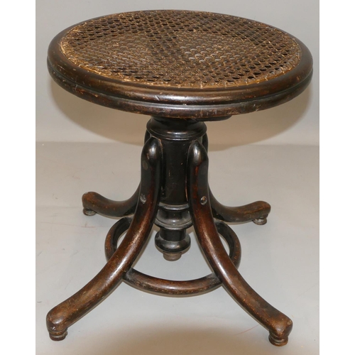 870 - A Thonet bent wood swivel piano stool with Bergere top, splayed legs.