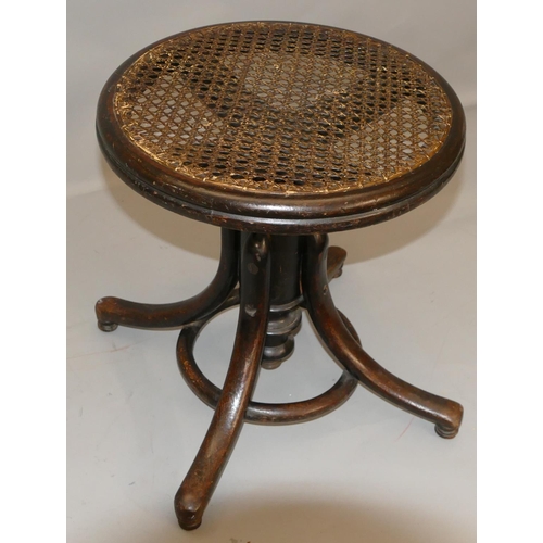 870 - A Thonet bent wood swivel piano stool with Bergere top, splayed legs.