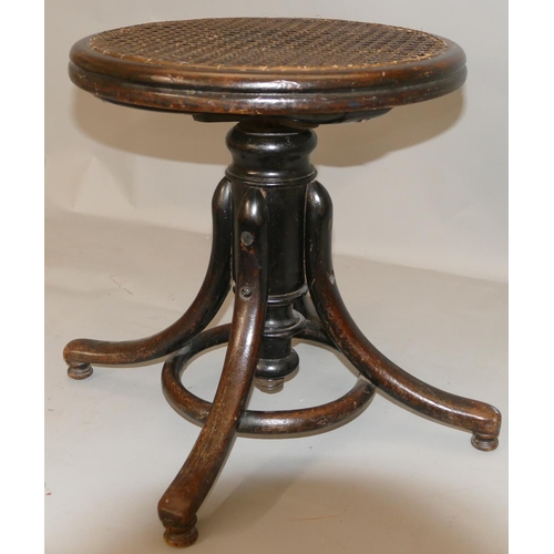 870 - A Thonet bent wood swivel piano stool with Bergere top, splayed legs.