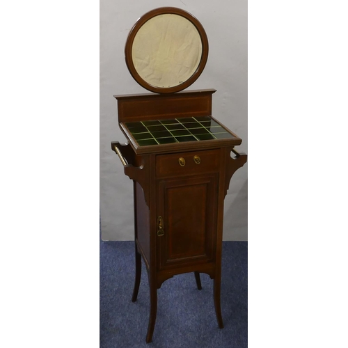 872 - An Edwardian mahogany wash stand with circular bevelled mirror above green tiled top, single drawer ... 