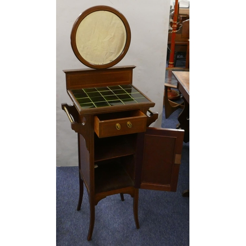 872 - An Edwardian mahogany wash stand with circular bevelled mirror above green tiled top, single drawer ... 