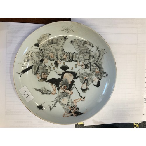 47 - An 18th/19th Century Oriental round dish on white and black ground with allover figure decoration, 2... 