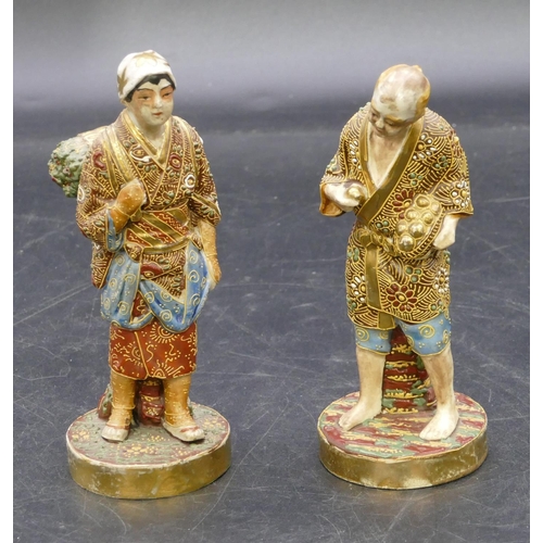 108 - A pair of Oriental Satsuma figures of standing gentleman and lady with all over raised floral, leaf ... 