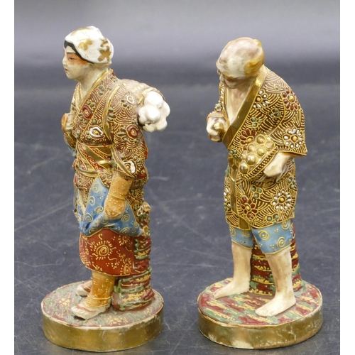 108 - A pair of Oriental Satsuma figures of standing gentleman and lady with all over raised floral, leaf ... 