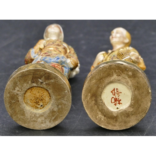 108 - A pair of Oriental Satsuma figures of standing gentleman and lady with all over raised floral, leaf ... 