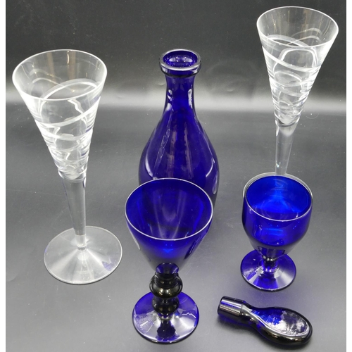 11 - A Bristol blue glass round bulbous thin necked decanter with stopper, 2 other Bristol blue glasses a... 