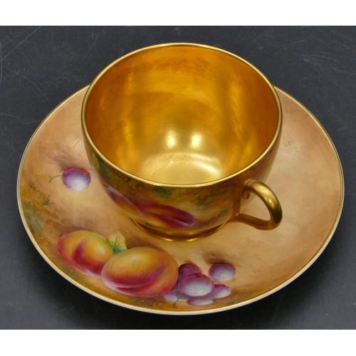 117 - A Royal Worcester porcelain cup and saucer decorated by Frank Roberts with all over multi-coloured p... 