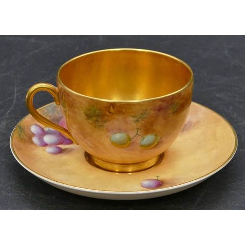 117 - A Royal Worcester porcelain cup and saucer decorated by Frank Roberts with all over multi-coloured p... 