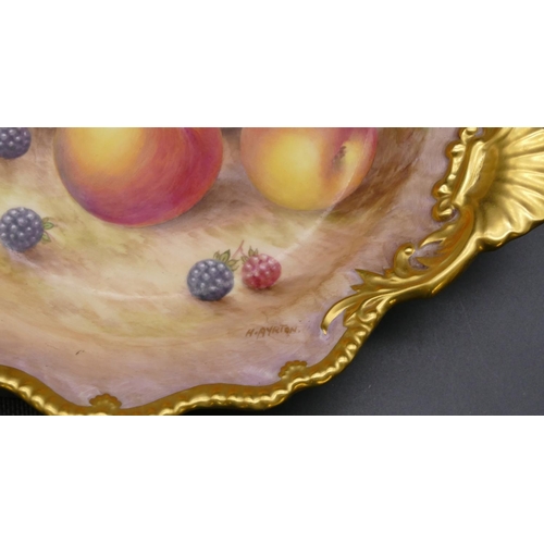 121 - A Royal Worcester round scallop shaped dish decorated by Harry Ayrton with multi-coloured fruit deco... 