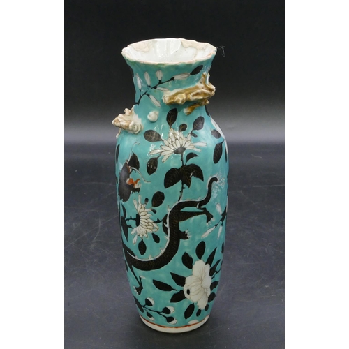 123 - An Oriental round bulbous thin necked trumpet shaped vase on turquoise ground with black and white d... 