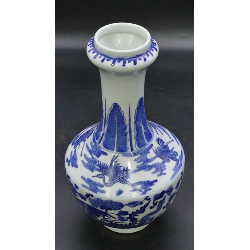 124 - An Oriental round bulbous thin necked trumpet shaped vase on blue and white ground with dragon and p... 