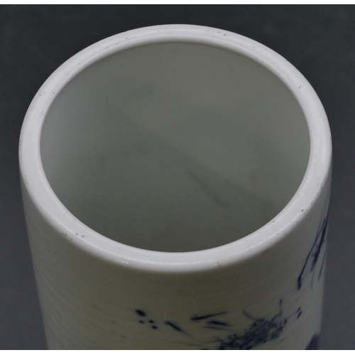 126 - An Oriental cylindrical brush pot on blue and white ground with shrimp decoration, 14cm high.