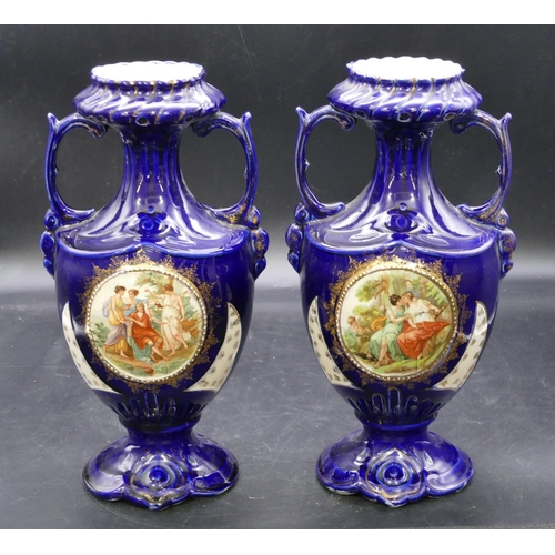 129 - A pair of round bulbous thin necked trumpet shaped 2-handled vases on royal blue ground with circula... 