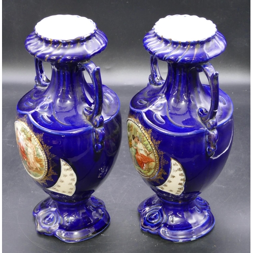 129 - A pair of round bulbous thin necked trumpet shaped 2-handled vases on royal blue ground with circula... 