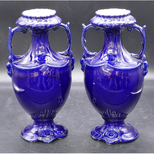 129 - A pair of round bulbous thin necked trumpet shaped 2-handled vases on royal blue ground with circula... 