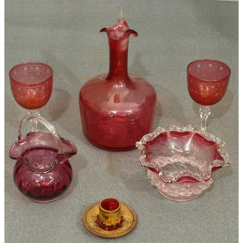 130 - A ruby glass round bulbous thin necked jug with clear handle (no stopper and slight chip to rim), 20... 