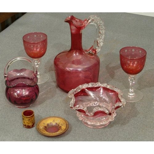 130 - A ruby glass round bulbous thin necked jug with clear handle (no stopper and slight chip to rim), 20... 