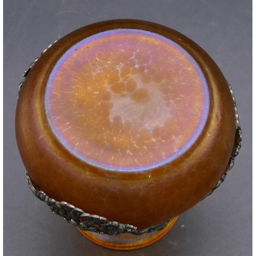 136 - A Loetz style round bulbous thin necked trumpet shaped vase on orange ground with silver plated band... 