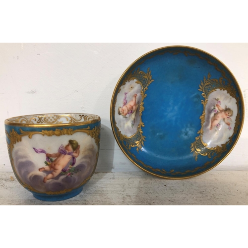 140 - A Sevres small porcelain cup and saucer on turquoise ground with hand painted cupid, floral and gilt... 