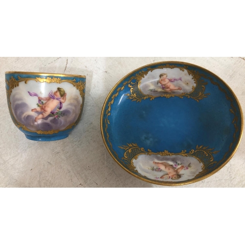 140 - A Sevres small porcelain cup and saucer on turquoise ground with hand painted cupid, floral and gilt... 