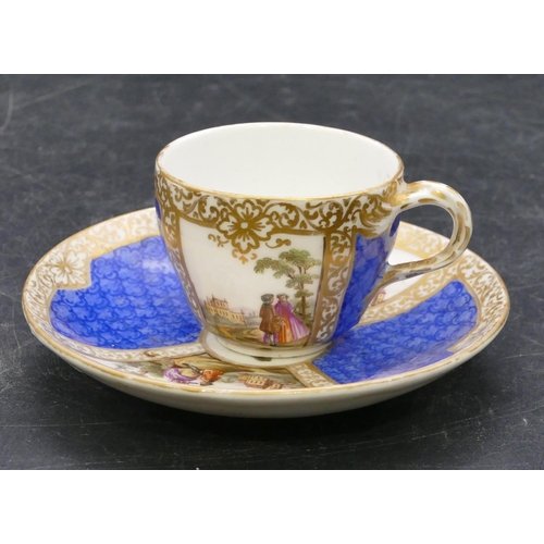 141 - A Meissen style cup and saucer on white and blue ground with hand painted figure, landscape and gilt... 