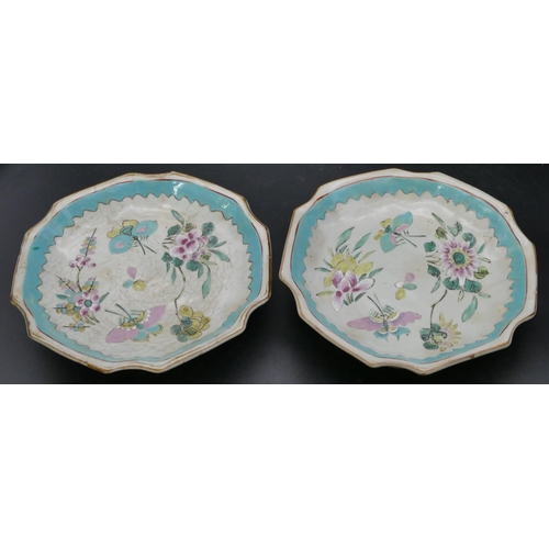 143 - A pair of Oriental round scallop shaped shallow comports on white and turquoise ground with butterfl... 