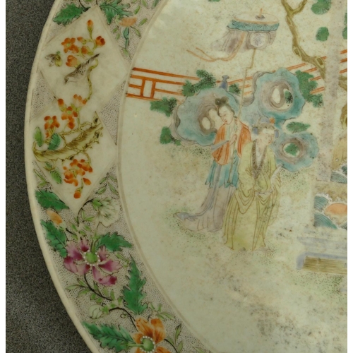 144 - A 19th Century Oriental charger with multi-coloured figure, bird, floral, leaf and scroll decoration... 