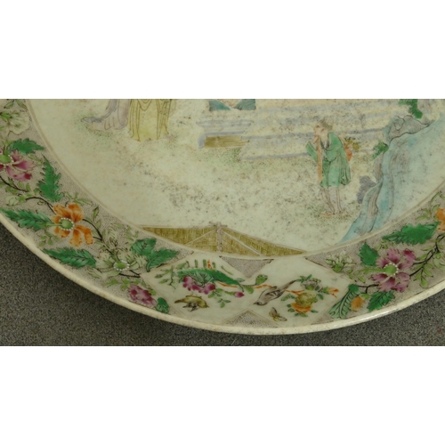 144 - A 19th Century Oriental charger with multi-coloured figure, bird, floral, leaf and scroll decoration... 