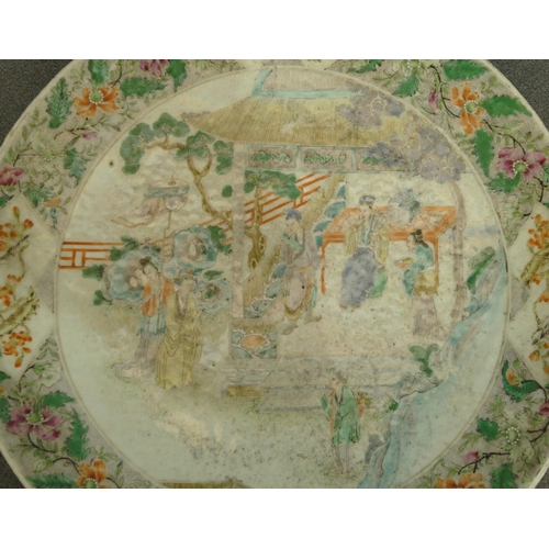 144 - A 19th Century Oriental charger with multi-coloured figure, bird, floral, leaf and scroll decoration... 