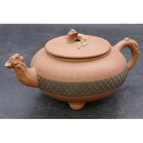 145 - A Chinese terracotta round bulbous shaped teapot with animal finial, 20cm long overall, 10cm high.