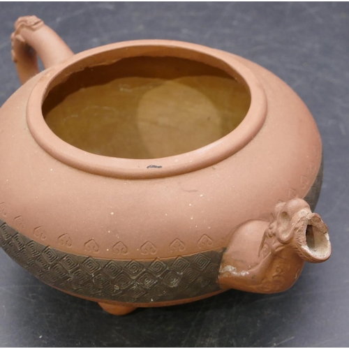 145 - A Chinese terracotta round bulbous shaped teapot with animal finial, 20cm long overall, 10cm high.