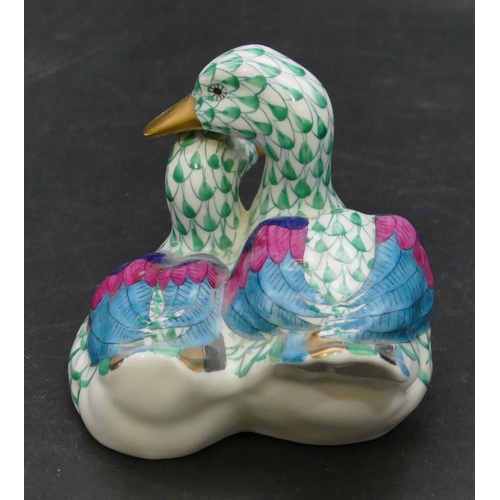 15 - A Herend group of 2 ducks on white and green ground, 11.2cm wide.