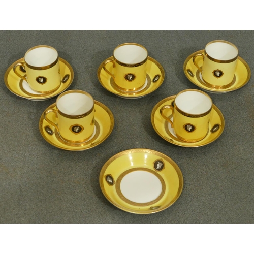 151 - A set of 5 Naples porcelain coffee cans, 6 saucers on white and yellow ground with black and white f... 