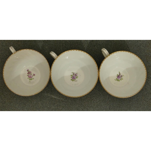 153 - A set of 3 Dresden tea cups and 5 matching saucers with crinkled rims on white ground with multi-col... 