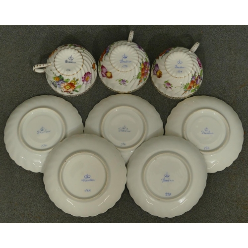 153 - A set of 3 Dresden tea cups and 5 matching saucers with crinkled rims on white ground with multi-col... 