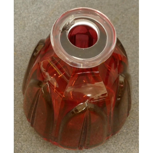 154 - A ruby glass round bulbous thin necked decanter with stopper mounted with shot glass (chip to inner ... 