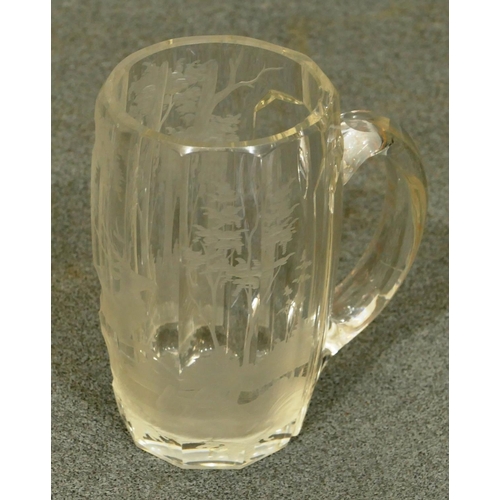 157 - A clear glass half pint tankard with engraved stag and landscape decoration, 12cm high