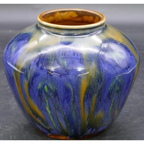 160 - A Royal Doulton glazed earthenware bulbous thin necked vase on blue ground with coloured striped dec... 