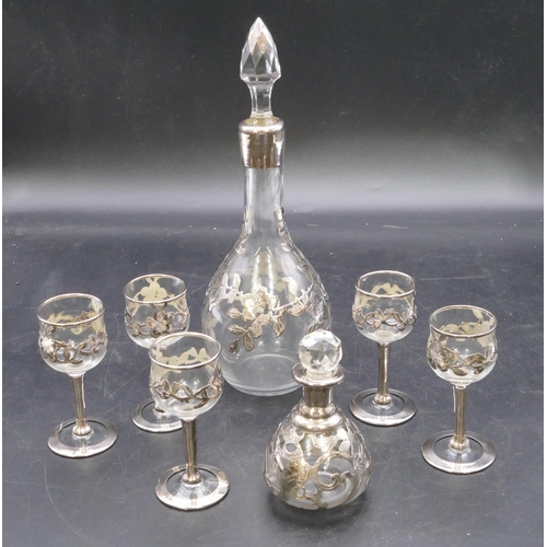 168 - A clear glass and silver mounted round bulbous thin necked liqueur decanter with stopper having rais... 