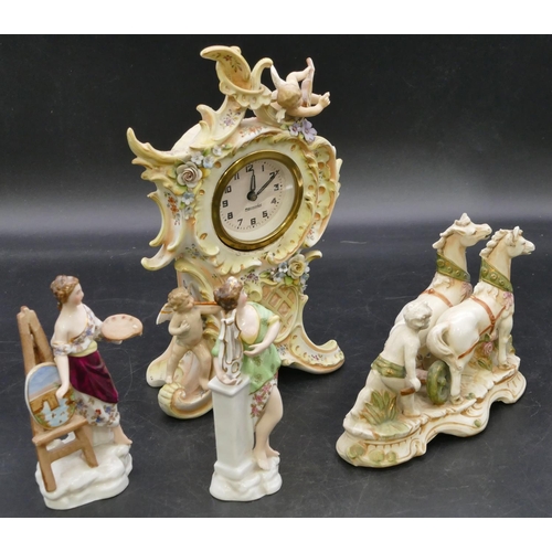 169 - A Continental china timepiece with raised cupid and encrusted floral decoration, white dial with Ara... 