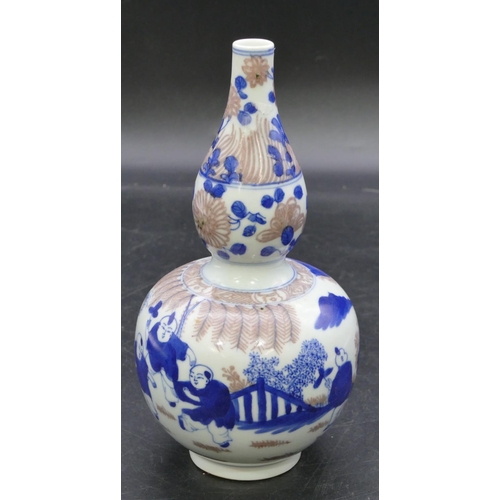 172 - An Oriental gould shaped vase on white, blue and red ground with figure decoration, 20cm high.