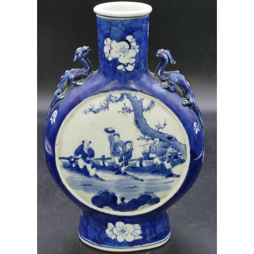 176 - An Oriental round bulbous flask shaped vase with raised inset handles on blue and white ground with ... 